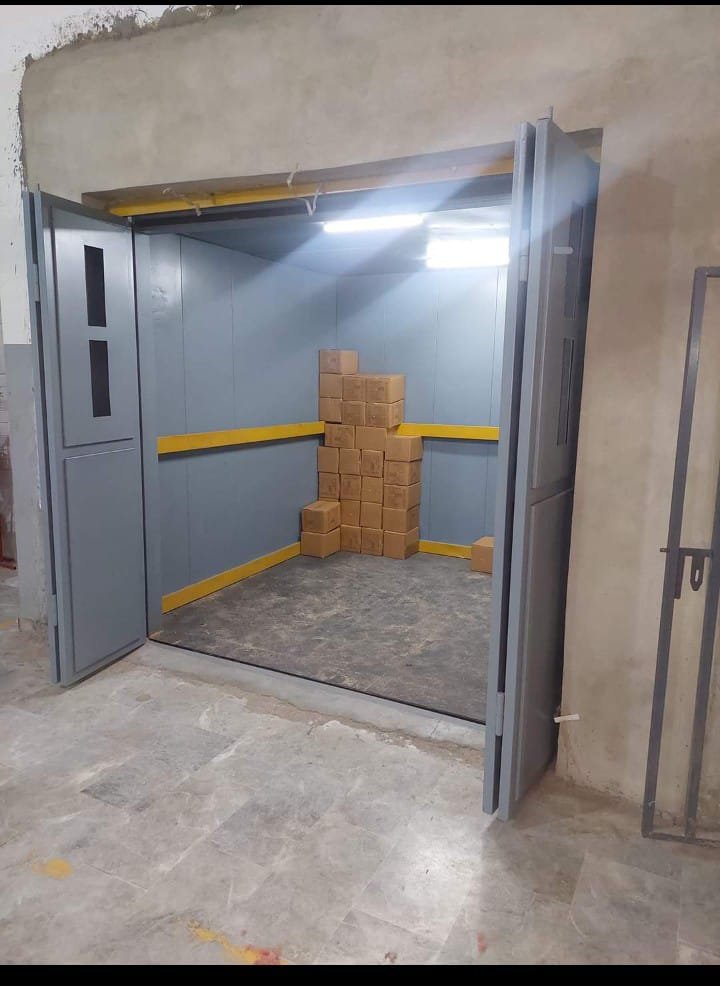 Industrial freight elevator with open doors